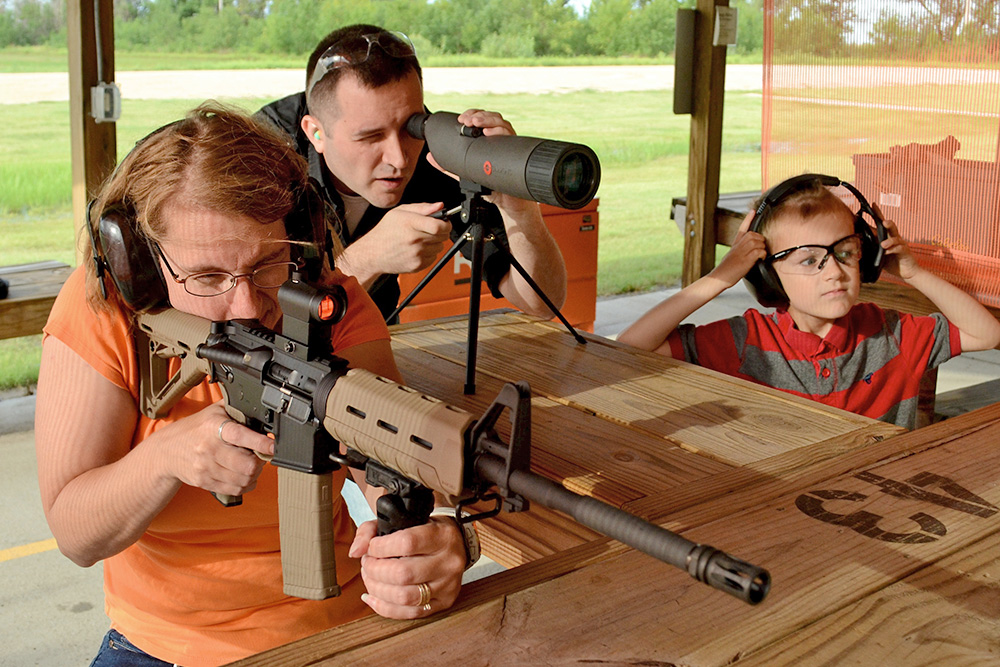 photo of man shooting handgun